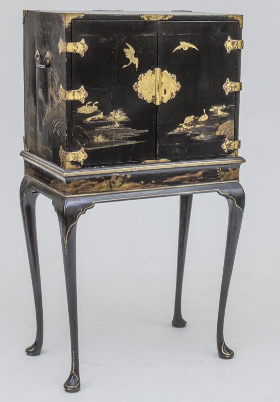 Chinoiserie lacquered cabinet on stand,: cabinet with doors opening to fitted interior, gilt decoration throughout, raised on cabriole legs. 52"H x 28.5"W x 17"D, Circa - 1920.