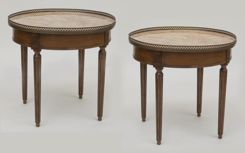 Pr. French marble top console tables,: raised on tapered fluted legs. PROVENANCE: From the Vivian Young and Lady Primrose's Collection, Dallas, TX. 24.75"H x 26.5" Dia., Circa - 1925.