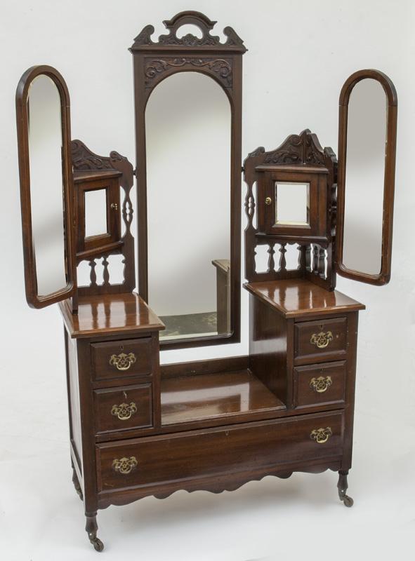 Edwardian walnut Princess dressing table,: with three swinging beveled mirrors and drop center. PROVENANCE: From the Vivian Young and Lady Primrose's Collection, Dallas, TX. 74.5"H x 42"W x 18.25"D, Circa - 1900.
