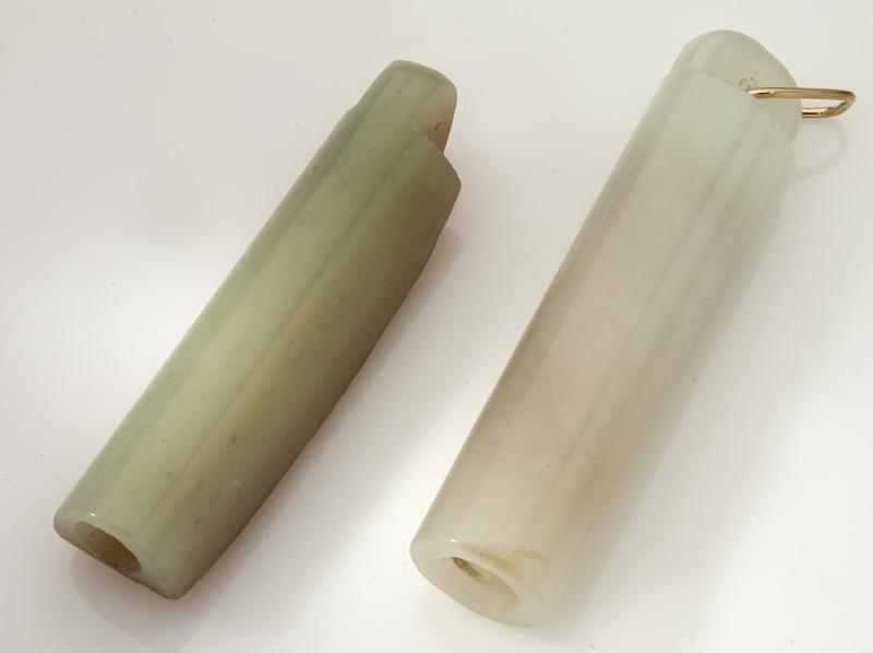 (2) Chinese Qing carved jade feather holders,: one having russet skin on one side, one with gold metal ring. 3"H and 2.75"H, Circa - 18th - 19th C.
