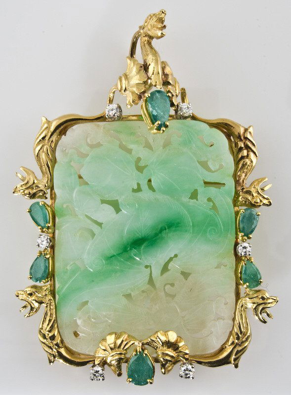 18K gold, diamond, emerald and jade pendant: and broach centered by a carved and pierced piece of mutton fat and spinach jade in an 18K mount decorated with dragons, highlighted with 6 round brilliant cut diamonds, .60 cts. H-I color, SI1 averag