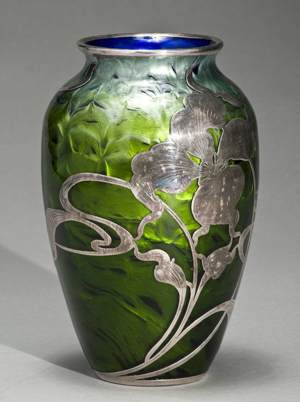 Loetz titania glass vase with silver overlay: in a floral design. The silver base marked, "L Sterling". 7.5"H, Circa - Turn of the century.