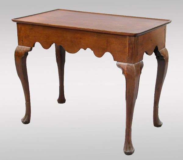 A New England Queen Anne walnut tea table having