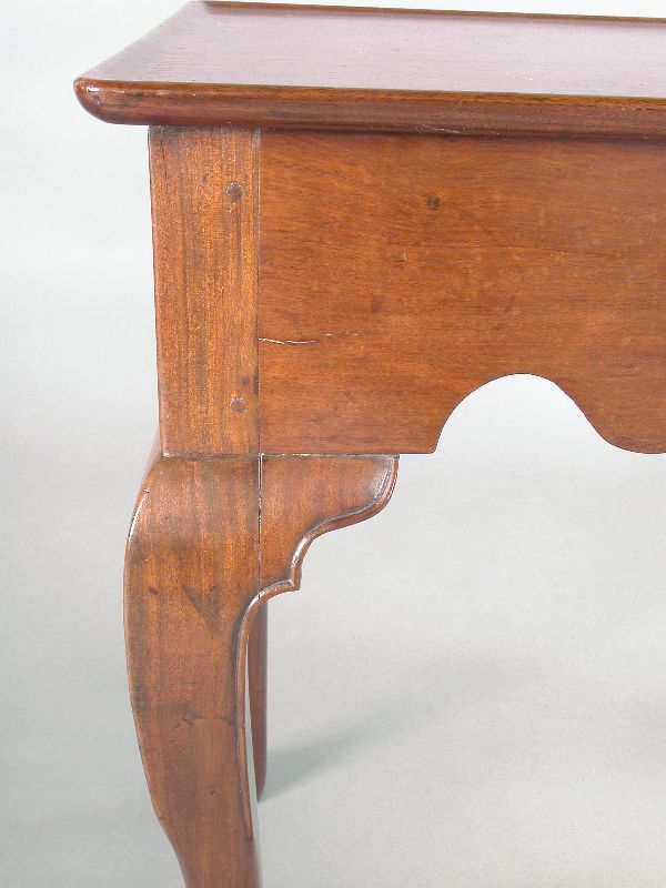 A New England Queen Anne walnut tea table having - 2
