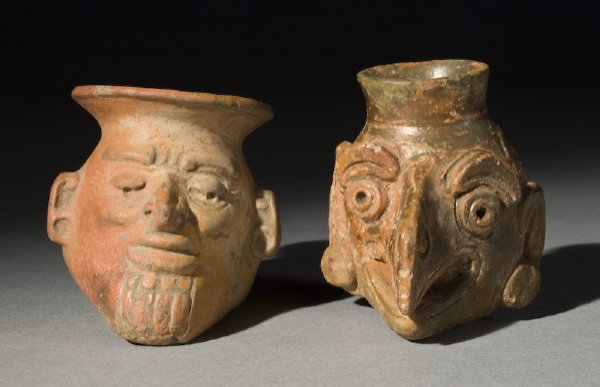 2 Pcs. Pre-Columbian pottery including: (1) Mayan P: 2 Pcs. Pre-Columbian pottery including: (1) Mayan Postclassic reduced fired plumbate poison bottle of zoomorphic vulture form, intact with a minor stress crack and mineral deposits; (1) positive fired