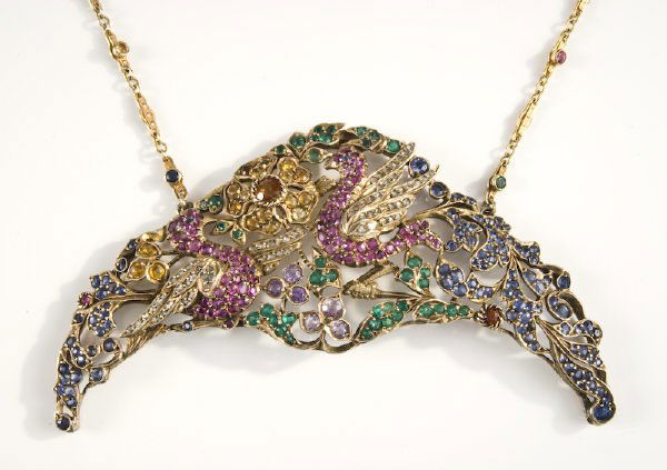 Art Deco silver purse handle necklace conversion, t: Art Deco silver purse handle necklace conversion, the gold plated silver handle featuring two birds amongst flowers set with 96 modified brilliant cut sapphires, 3.70 cts. approximate total, 39 modifi