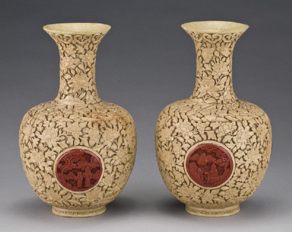 Pr. Chinese white cinnabar vases finely carved to: Pr. Chinese white cinnabar vases finely carved to depict peonies and figures in a landscape. 10"H, Circa - 19th C.