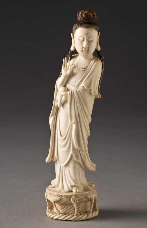 Chinese carved ivory Guanyin holding a vase in her: Chinese carved ivory Guanyin holding a vase in her (International shipping IS NOT available on this item. This ivory was imported legally into the United States.) left hand and a Buddhist Mudra in her