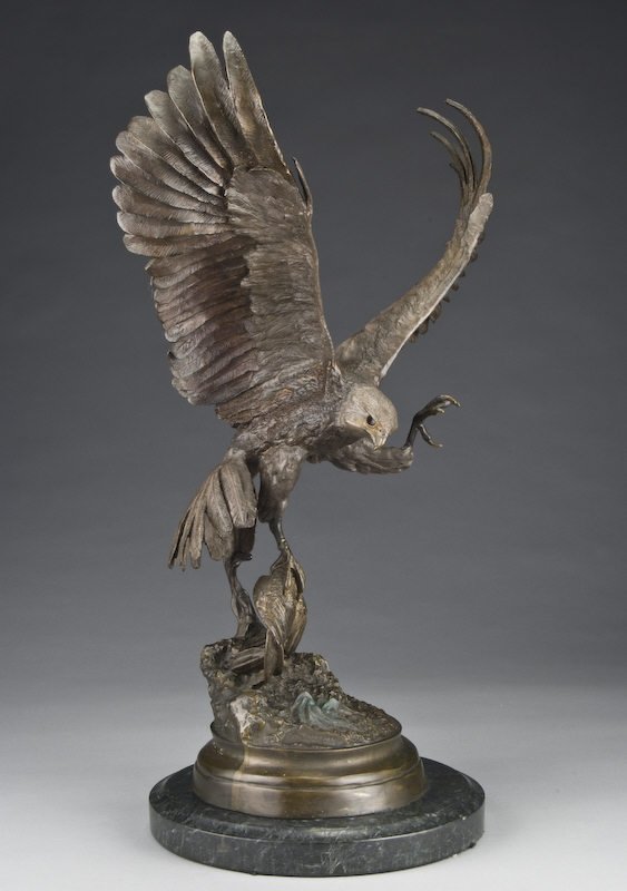 After Jules Moigniez bronze sculpture of an eagle : After Jules Moigniez bronze sculpture of an eagle with a captured bird in right talon on a circular bronze base on top of a marble socle, having a dark patina. Inscribed on bronze base, "J. Moigniez".