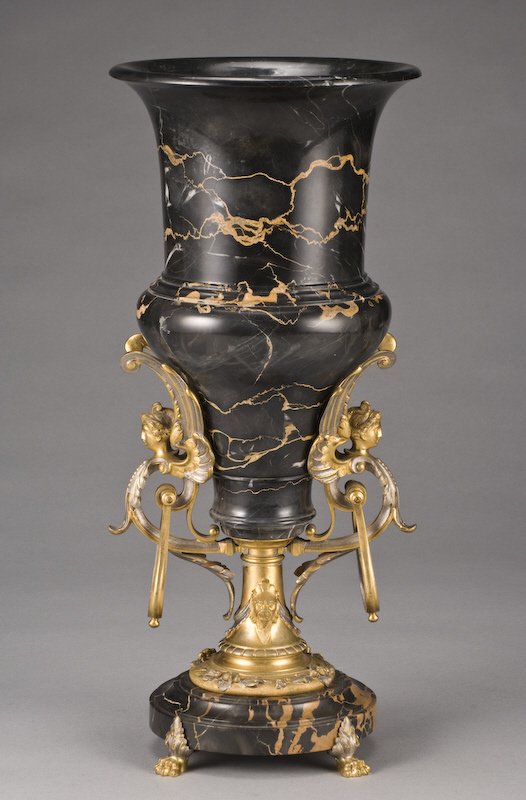 French ormolu mounted marble campana form urn: having caryatid shaped handles raised on a circular socle with paw feet. Drilled. 18"H, Circa - 20th C.