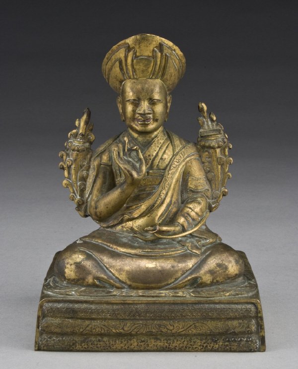 Chinese-Tibetan gilt bronze of Master Zong Ka Ba: seated on the throne, with his hands in Buddhist mudra. Sutra inside the base. 6.25"H, Circa - 19th C.