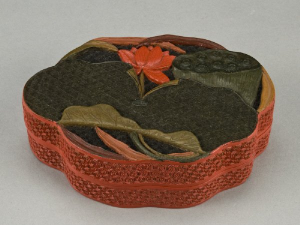Chinese Qing Qianlong cinnabar lacquered box: depicting lotus. Provenance: Important New York Collection. 1.75"H x 6"W x 4"D, Circa - 18th C.
