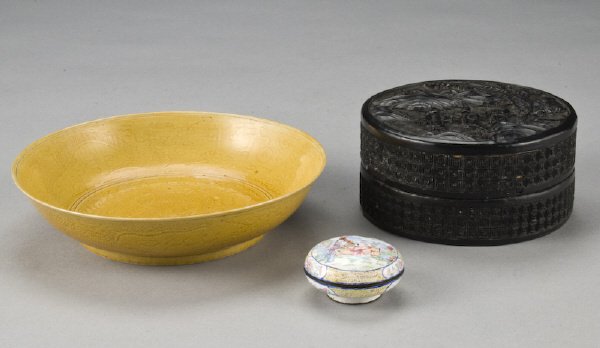 (3) Chinese items including: (1) cinnabar round: box depicting figures in a landscape, 5" Dia.; (1) enamel over bronze ink pad, 2" Dia.; (1) yellow bowl depicting two dragons chasing a flaming ball, 7" Dia. Circa - Late 19th - Early 20th C.