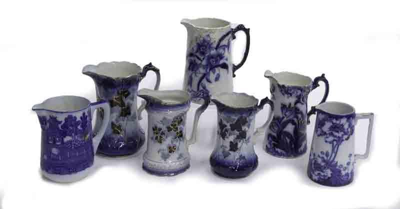 (7) Antique flow blue pitchers. (1 of 15)