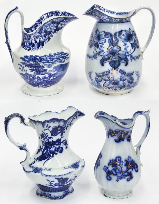 (4) Large antique flow blue water pitchers. (1 of 11)