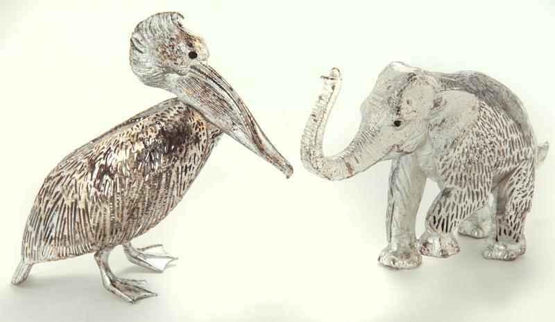 (2) Christofle figures,: (2) Christofle figures, including (1) elephant and (1) pelican. Each marked for Christofle. Elephant: 3.75"H x 6"W; Pelican: 4"H x 4.5"W.