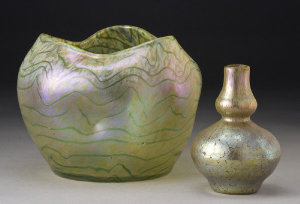 (2) Bohemian glass vases: including: (1) Kralik iridescent with soft yellow ground and green bands with pinched sides and ruffled rim, unsigned; (1) Loetz iridescent crackled finish with bulbous form, unsigned. Largest: 8"H x 