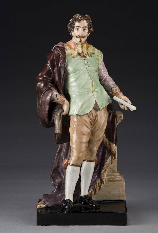 Impressive Staffordshire pearlware figure modeled: as Sir Walter Raleigh, standing clothed in a flowing purple robe, a scroll in one hand, leaning against a column. Restoration. 22"H, Circa - Early 19th C.
