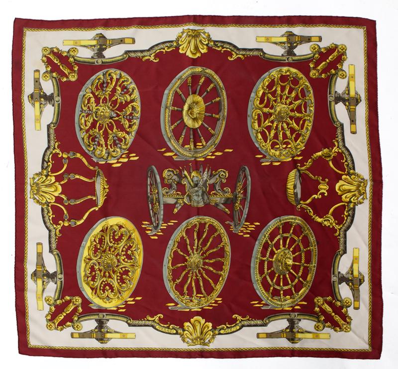 Hermes "Roues de Canon" silk scarf: Hermes "Roues de Canon" silk scarf. in burgundy and white, designed by Caty Latham. 36" Sq.