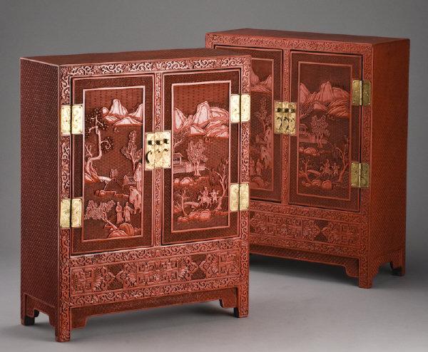 Pr. Chinese carved cinnabar cabinets depicting: figures in a landscape. 24"H x 19.25"W x 8"D, Circa - 20th C.