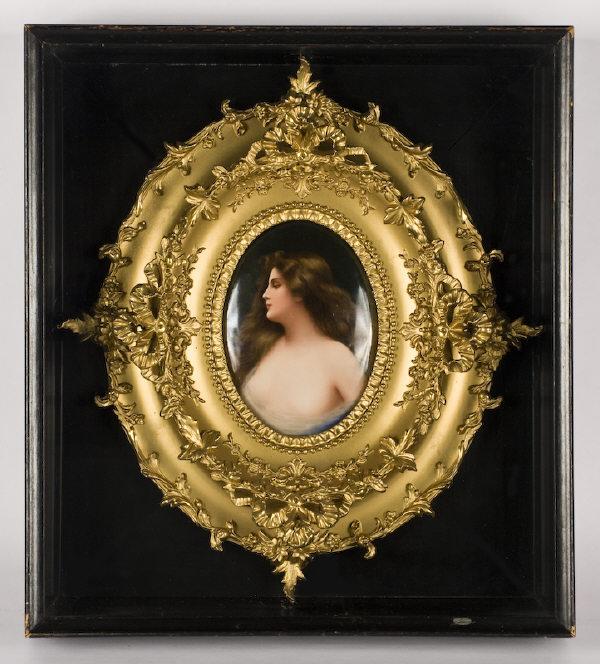 KPM Berlin porcelain plaque titled, "Erbluht": painted as a woman with flowing hair in a diaphanous gown, housed in an ornate gilt frame within a glass front shadow box. Signed lower left, "Wagner". Impressed KPM with a scepter, with various impre