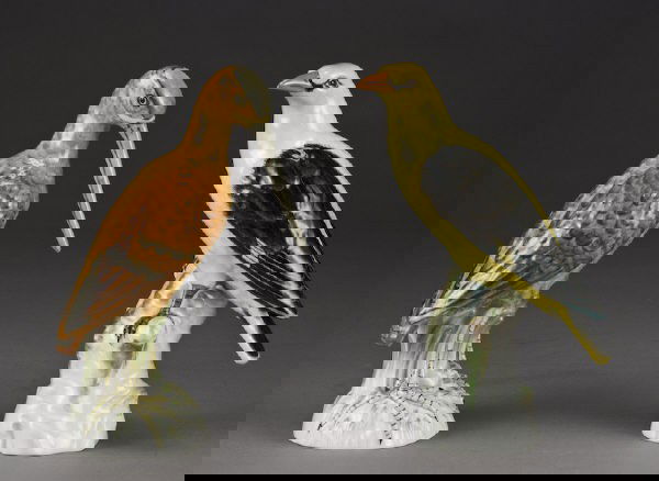 (2) KPM Berlin porcelain models of birds.: Both with over glaze red marks, and under glaze blue scepter marks. 8.25"H Circa - Early 20th C.