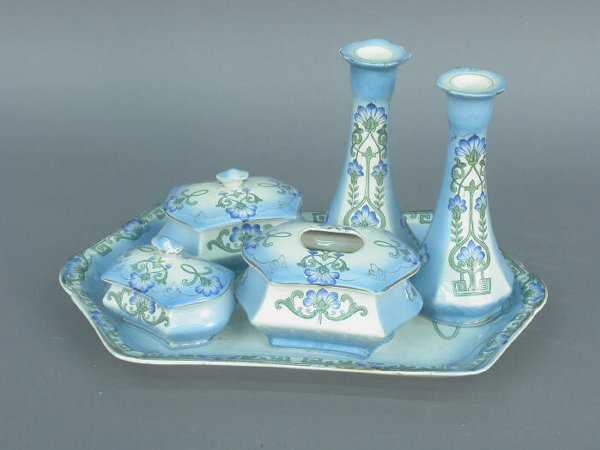 (6)pc Ceramic vanity set by Ford & Sons: (6)pc Ceramic vanity set by Ford & Sons consisting of (1) 9.25" x 14.25" tray, (2) 7"h candlesticks; (1) 4" x 5" hair receiver, and (2) smaller covered jewelry/pin boxes. Circa - 1900-1920.