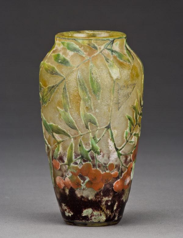 Daum Nancy French cameo vase,: cylindrical form in mottled yellow and amethyst decorated with cascading vitrified leafy branches with ripe red berries, signed, "Daum Nancy". 4.625"H, Circa - 1890-1925.