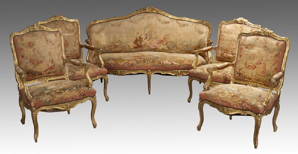 5 Pc. French Louis XV style gilt wood salon set,: the settee and four armchairs all with floral cresting detail to the back rails and seashell carving to legs and seat rails, the Aubusson tapestry coverings depicting courting scenes in landscape. Cha
