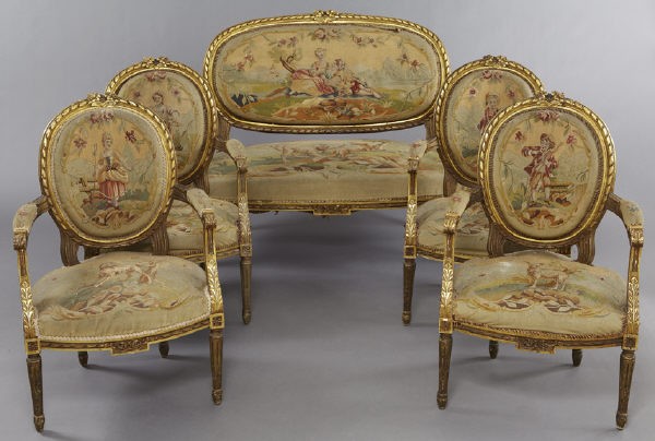 5 Pc. French Louis XVI style gilt wood salon set,: the settee and four arm chairs with floral cresting and ribbon banding, the seat rails with like decoration, the Aubusson tapestry coverings depicting courting scenes and animals of the wild. Chairs: 