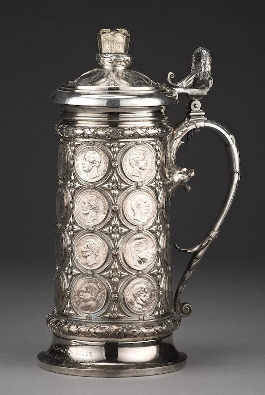 Silver plate coin set tankard, modeled in the: Renaissance Revival taste, set with German coins. The foot engraved, "From Albert Edward Prince of Wales To Mackenzie of Kintail Christmas 1883." The Clan Mackenzie is a Scottish Highland clan. 12.25"