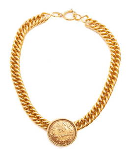 Chanel 31 Rue Cambon pendant necklace,: Chanel 31 Rue Cambon pendant necklace, gold tone, with oval Chanel mark. 16.25"L,