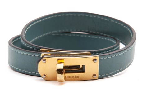 Hermes Kelly double bracelet,: Hermes Kelly double bracelet, with gold tone hardware. Stamped, "Hermes Paris Made in France". 15.25"L,