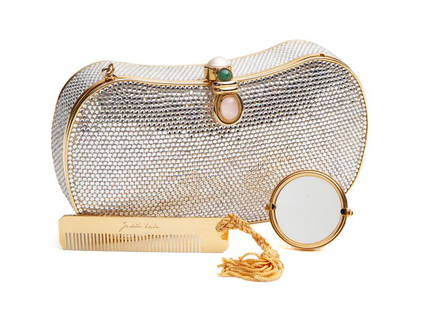 Judith Leiber minaudiere,: Judith Leiber minaudiere, silver crystals, gold tone hardware, jeweled clasp, and single drop-in chain. Interior lined with gold leather and marked, "Judith Leiber". Includes: mirror and comb. 4"H x