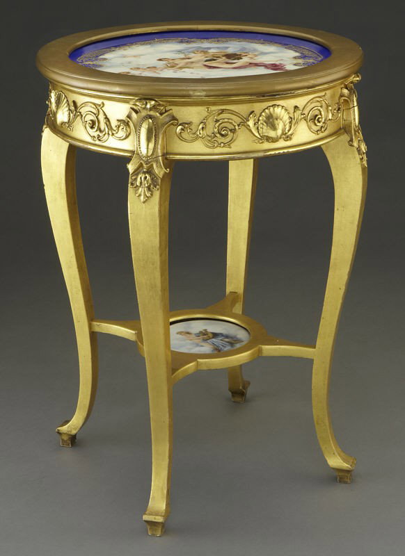 Napoleon III gilt wood and porcelain table: Napoleon III gilt wood and porcelain table having a gilt porcelain plaque depicting Venus with Cupid inset in the table top, the gilt wood frieze decorated with shells and rinceau, resting on cabriole