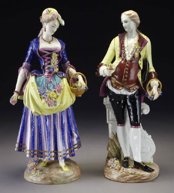 Pr. Impressive Meissen porcelain figures: Pr. Impressive Meissen porcelain figures modeled as a lady and gentleman in court dress each with a basket of flowers, standing on a naturalistically modeled base. Cross swords mark in blue under glaz