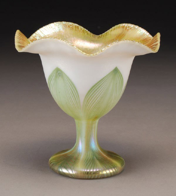 Quezal decorated flower form,: Quezal decorated flower form, footed coup?orm in opal glass decorated with green pulled feathers tipped in gold, signed, " Quezal H651" , 5" H. Circa - 1900.