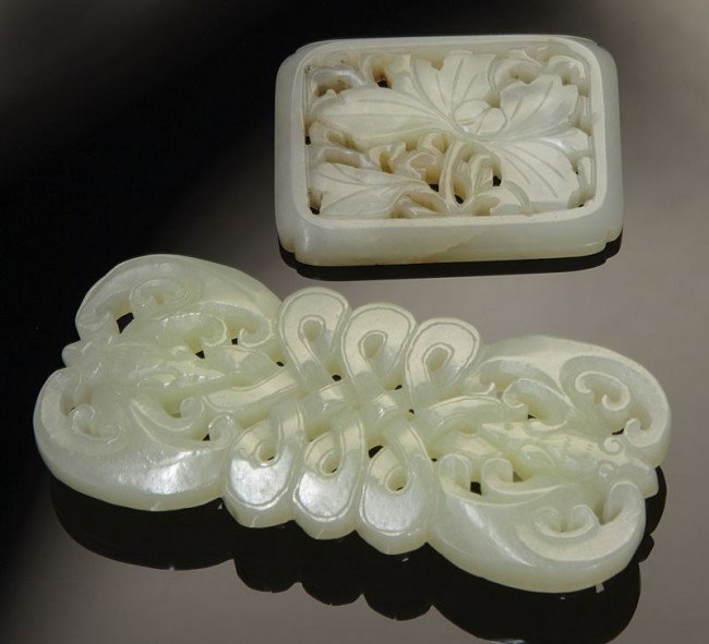 (2) Chinese Qing open carved jade belt buckles; (1): (2) Chinese Qing open carved jade belt buckles; (1) depicting bats; (1) depicting peonies. Largest: 3.25"L, Circa - 18th - 19th C.