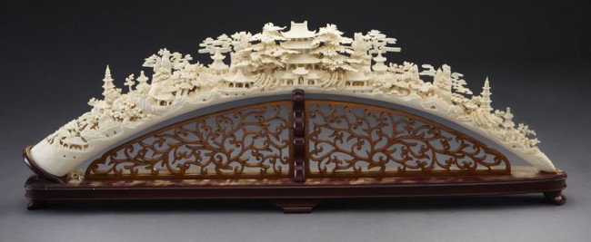 Chinese carved ivory tusk depicting figures in a (I: Chinese carved ivory tusk depicting figures in a (International buyers should note that several countries do not allow the importation of lots containing materials made from endangered species. This i