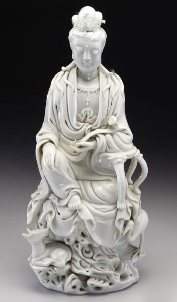 Chinese Qing blanc de chine porcelain Guanyin, hold: Chinese Qing blanc de chine porcelain Guanyin, holding a ruyi scepter in one hand, the other hand resting on her knee, with deer and cranes beneath her seat. 13.75"H, Circa - 19th C.