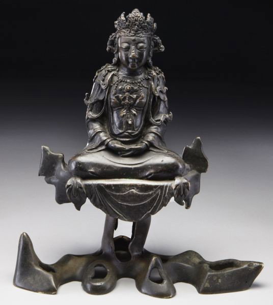 Chinese Ming bronze Guanyin, seated on a rock, hand: Chinese Ming bronze Guanyin, seated on a rock, hands in Buddhist mudra. 11.5"H x 10.5"W, Circa - 16th - 17th C.