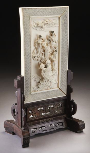 Chinese carved ivory table screen depicting (Intern: Chinese carved ivory table screen depicting (International buyers should note that several countries do not allow the importation of lots containing materials made from endangered species. This includ