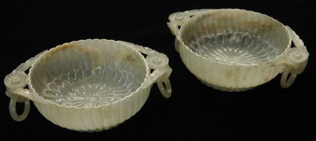 Pr. Chinese Qing Mughal style jade bowls, each wit: Pr. Chinese Qing Mughal style jade bowls, each with two free rings, depicting chrysanthemum. Provenance: By repute, Sotheby's New York, 1990's. 5.25" Dia.,