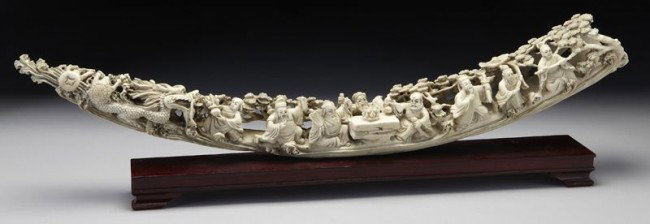 Chinese carved ivory tusk depicting eight (Interna: Chinese carved ivory tusk depicting eight (International buyers should note that several countries do not allow the importation of lots containing materials made from endangered species. This includes