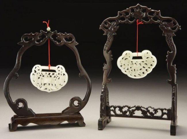 (2) Chinese Qing carved jade plaques depicting flo: (2) Chinese Qing carved jade plaques depicting flowers and insects. Largest pendant: 2.75"H x 3.5"W, Circa - 19th C.