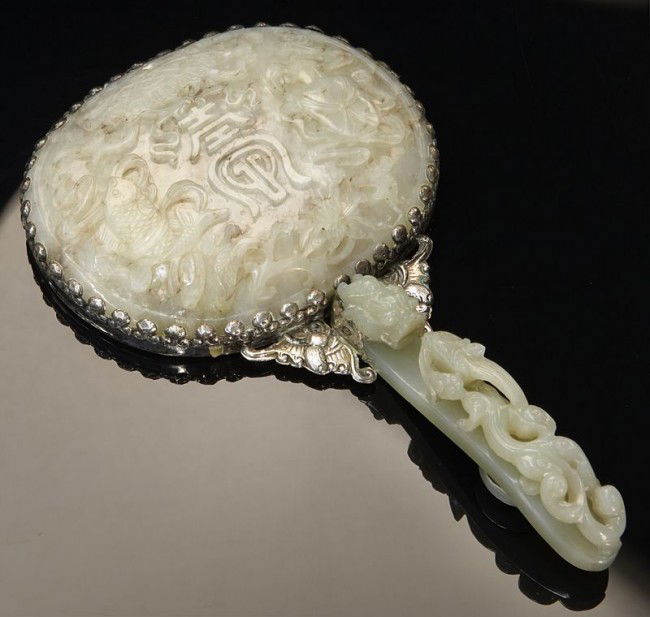 Chinese Qing silver mounted jade hand mirror, depi: Chinese Qing silver mounted jade hand mirror, depicting lucky symbols and dragons. 7.75"H x 4.5"W, Circa - 19th C.