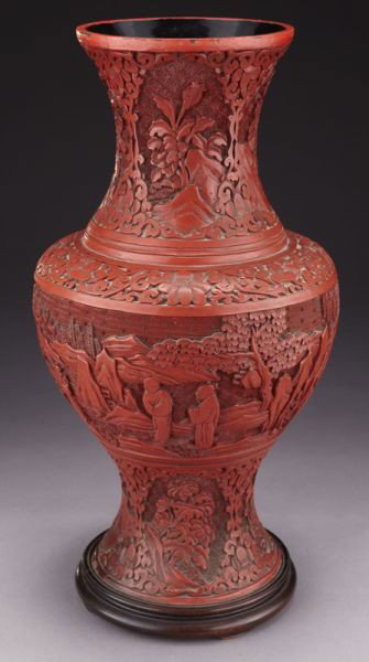 Chinese carved cinnabar vase depicting figures in : Chinese carved cinnabar vase depicting figures in a landscape. 16"H, Circa - 20th C.