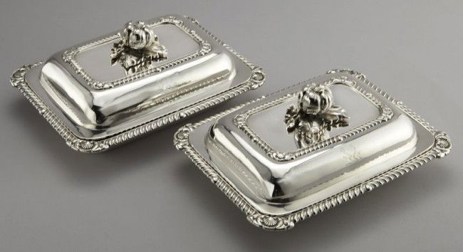 Pr. Paul Storr sterling silver entree dishes.: Each domed lid surmounted by a pomegranate form handle surrounded by a gadrooned border with shell corners over an engraved lion crest, the inside and base rims decorated ensuite. Marked for Paul Stor