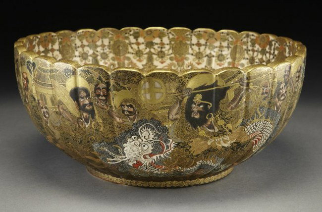 Large Japanese Satsuma bowl,: with a lobed body and scalloped rim, the interior finely painted with chrysanthemum detail and a dragon, the exterior painted with dragons and warriors. 12 character mark in gold on the base. 6.25"H x