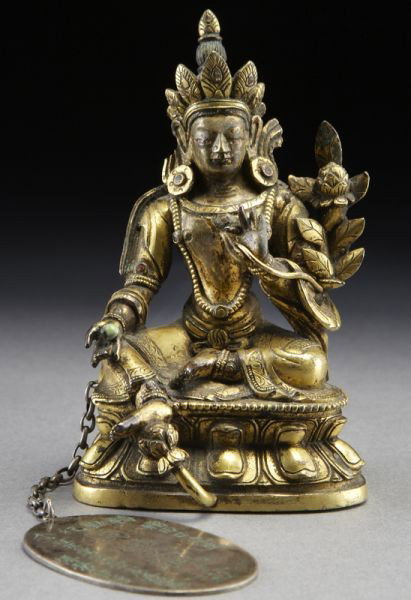 Chinese - Tibetan gilt bronze green Tara,: one hand holding flowers, the other holding a ball, seated on a lotus base. Attached to the bronze is an oval plaque which reads, "Friendship between Japan and Mongolia, a gift to Mr. Taguchi". 4.25"H